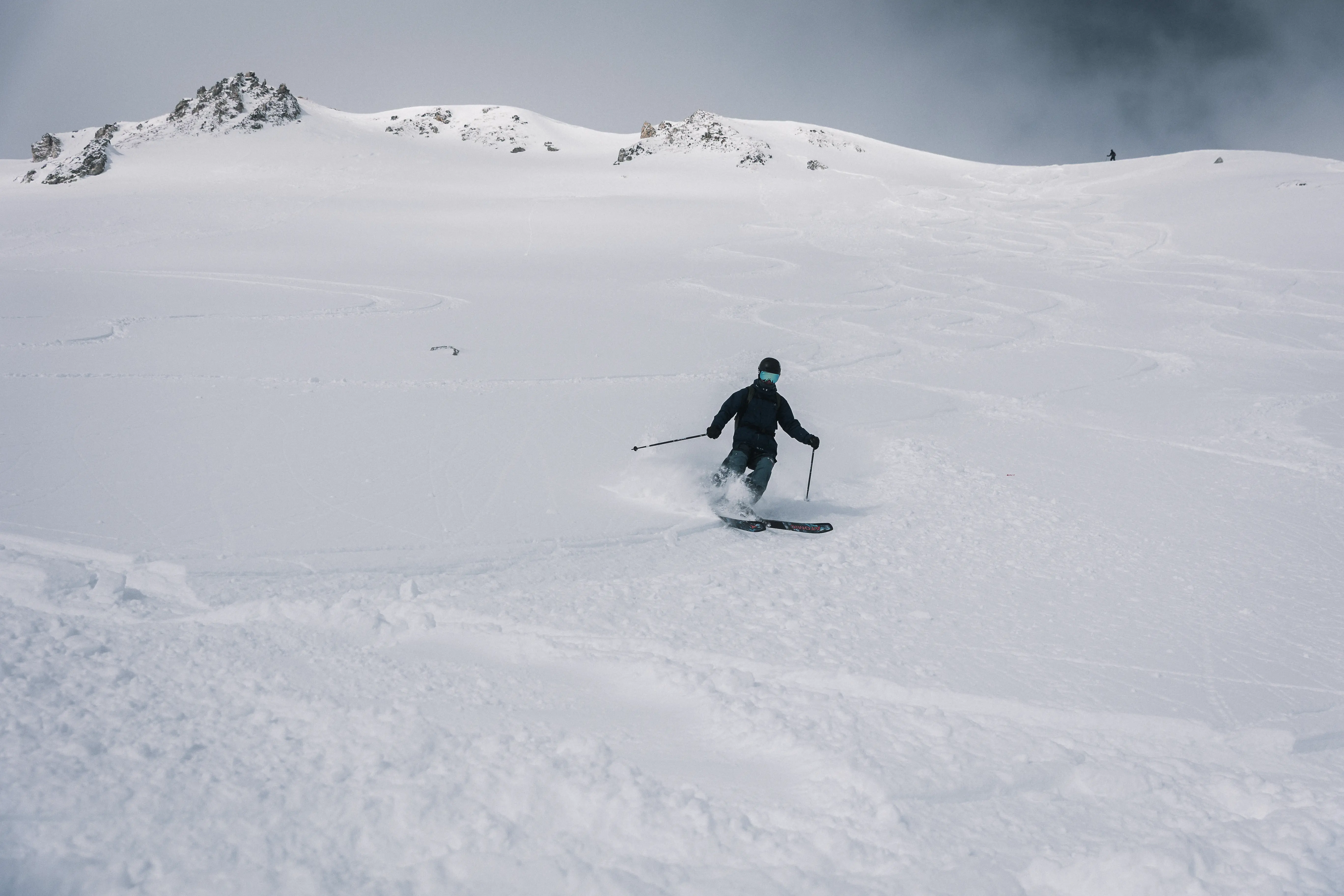 Skiing through fresh alpine backcountry powder